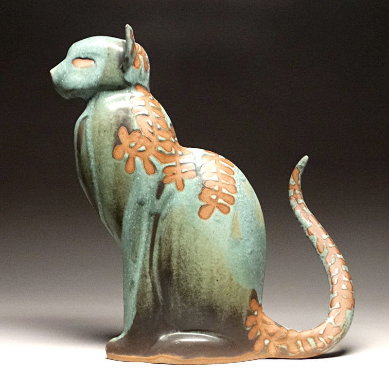 Sitting Cat in Green with Ferns