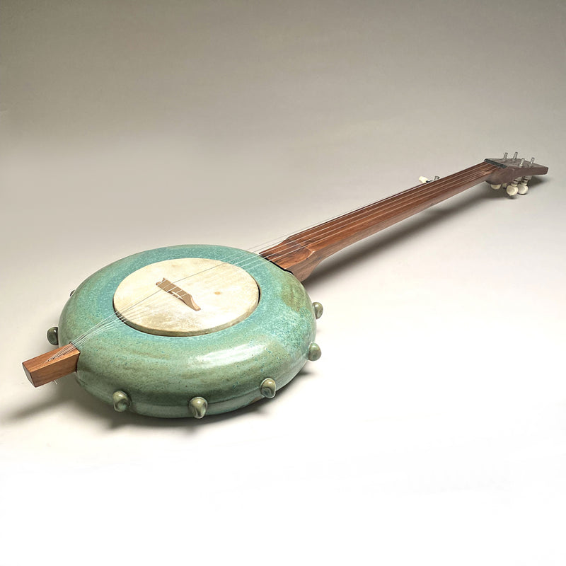 Banjo with stoneware pot and walnut